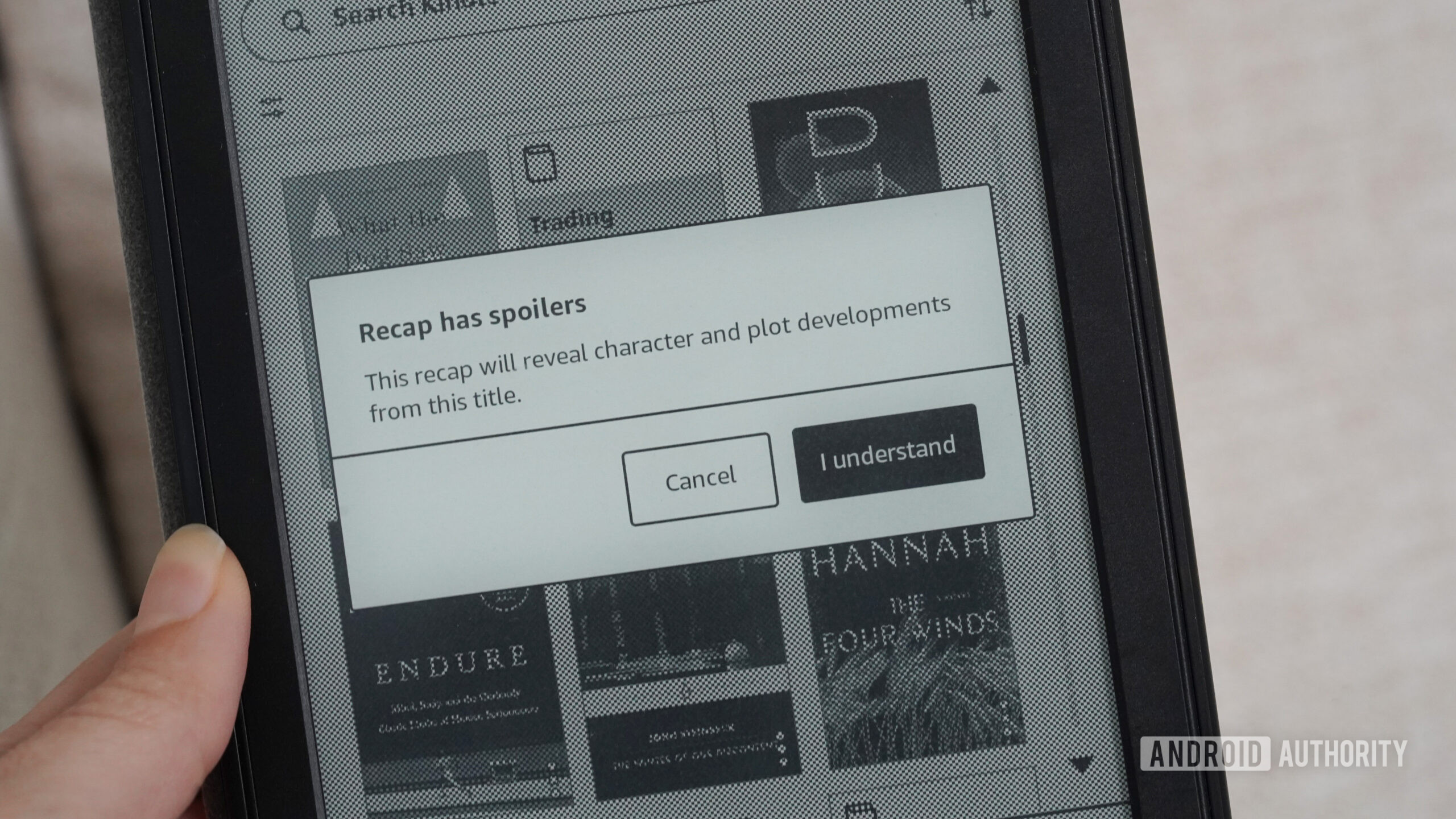 Kindle recapitula spoilers Um Kindle exibe o aviso de spoiler para repescagens.